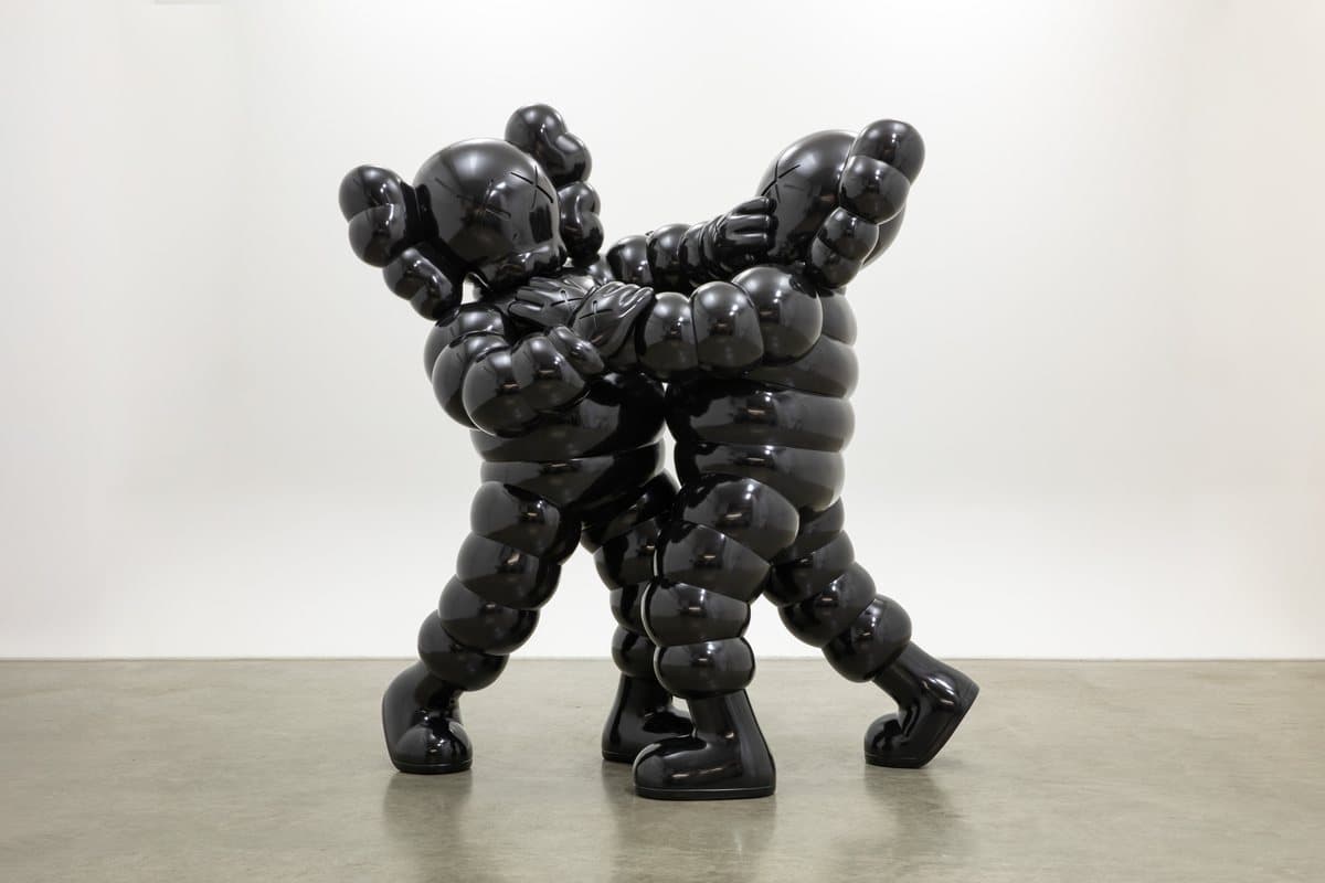 KAWS NECK AND NECK, two black figures entwined