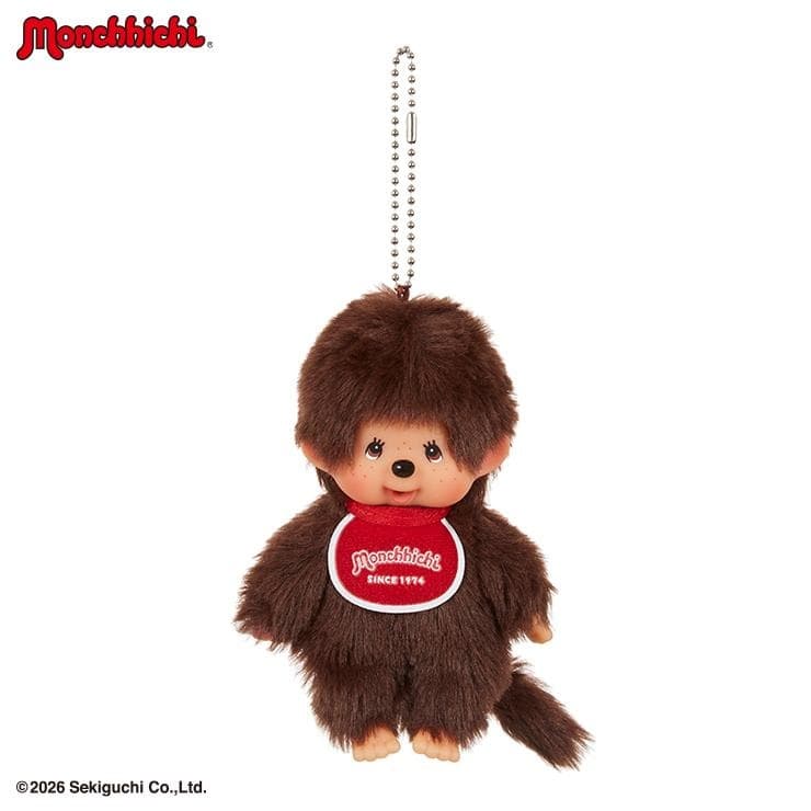 Plush Monchhichi boy keychain with a red bib on a ball chain